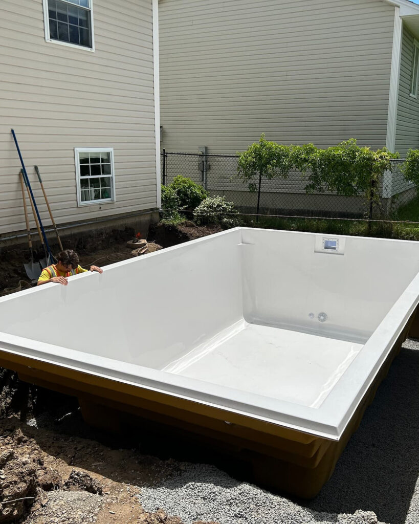 a fibreglass pool carefully placed in a back yard in Fredericton